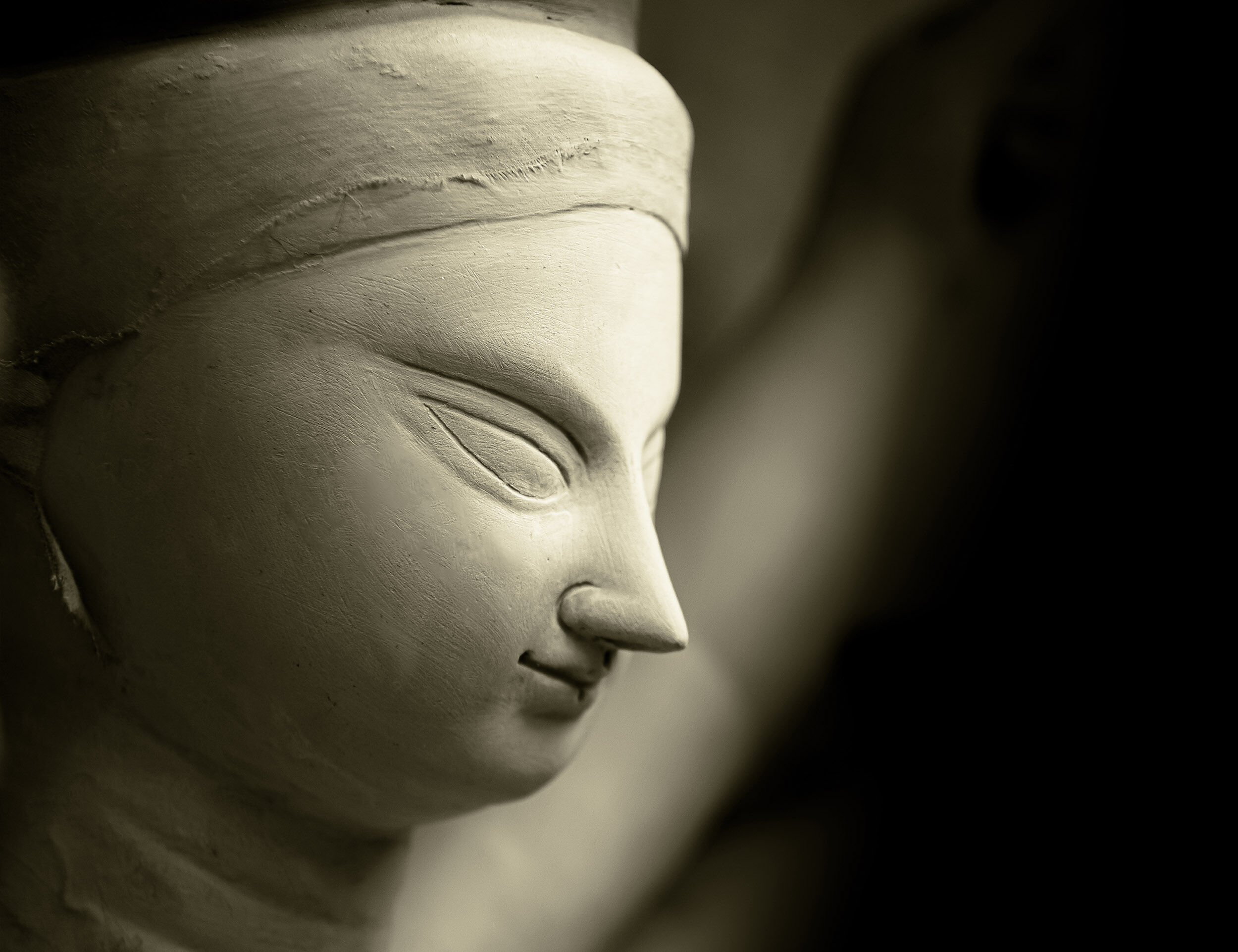 Close-up of Goddess Durga clay idol face during Navratri preparations